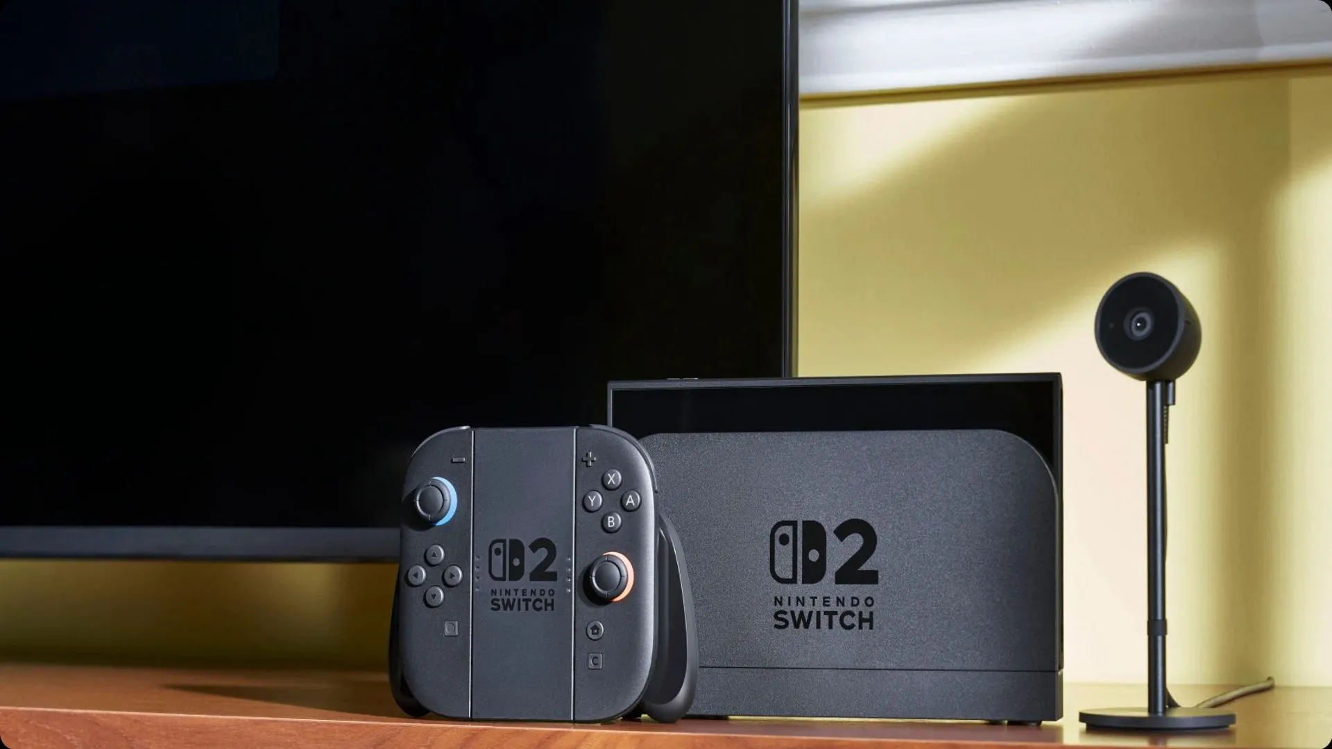 Hình ảnh chính thức của máy chơi game Nintendo Switch 2 cùng bộ điều khiển và micro, minh họa cho khả năng tương tác voice chat