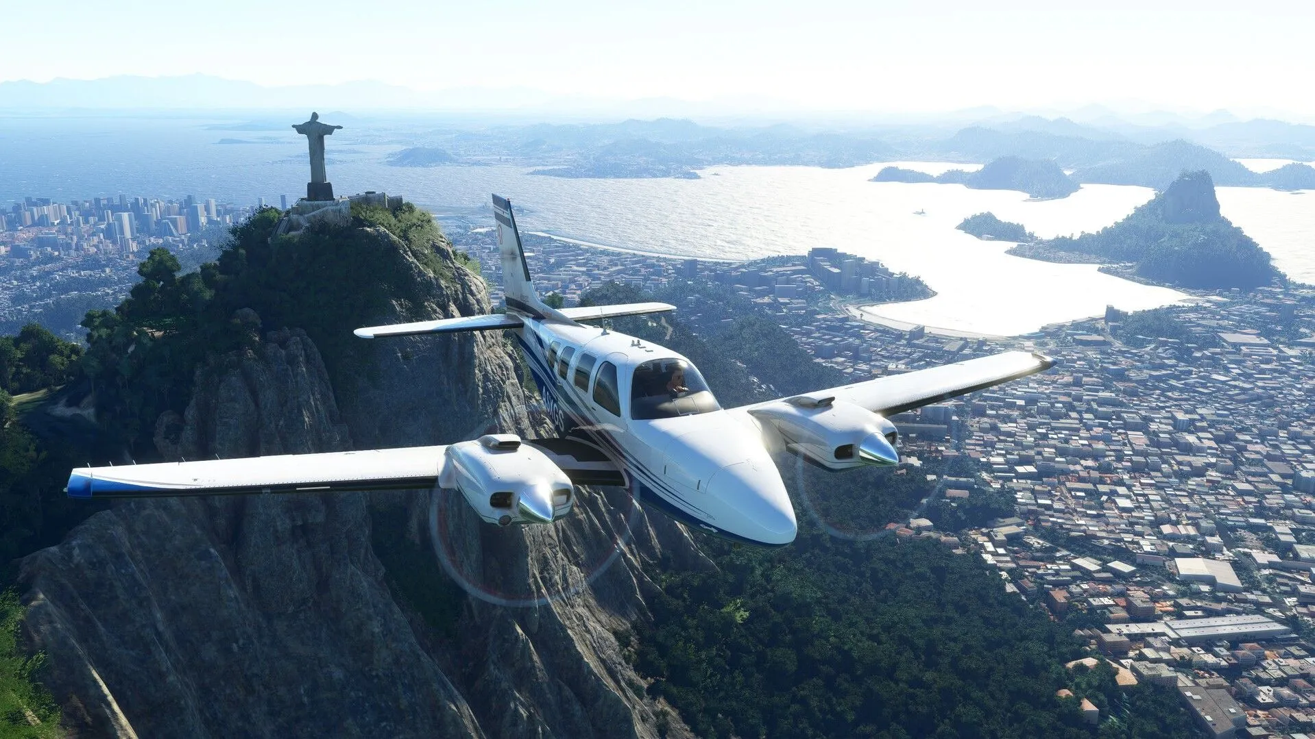 Ảnh chụp màn hình từ game Microsoft Flight Simulator hiển thị khung cảnh thành phố Rio de Janeiro trên màn hình ultrawide.