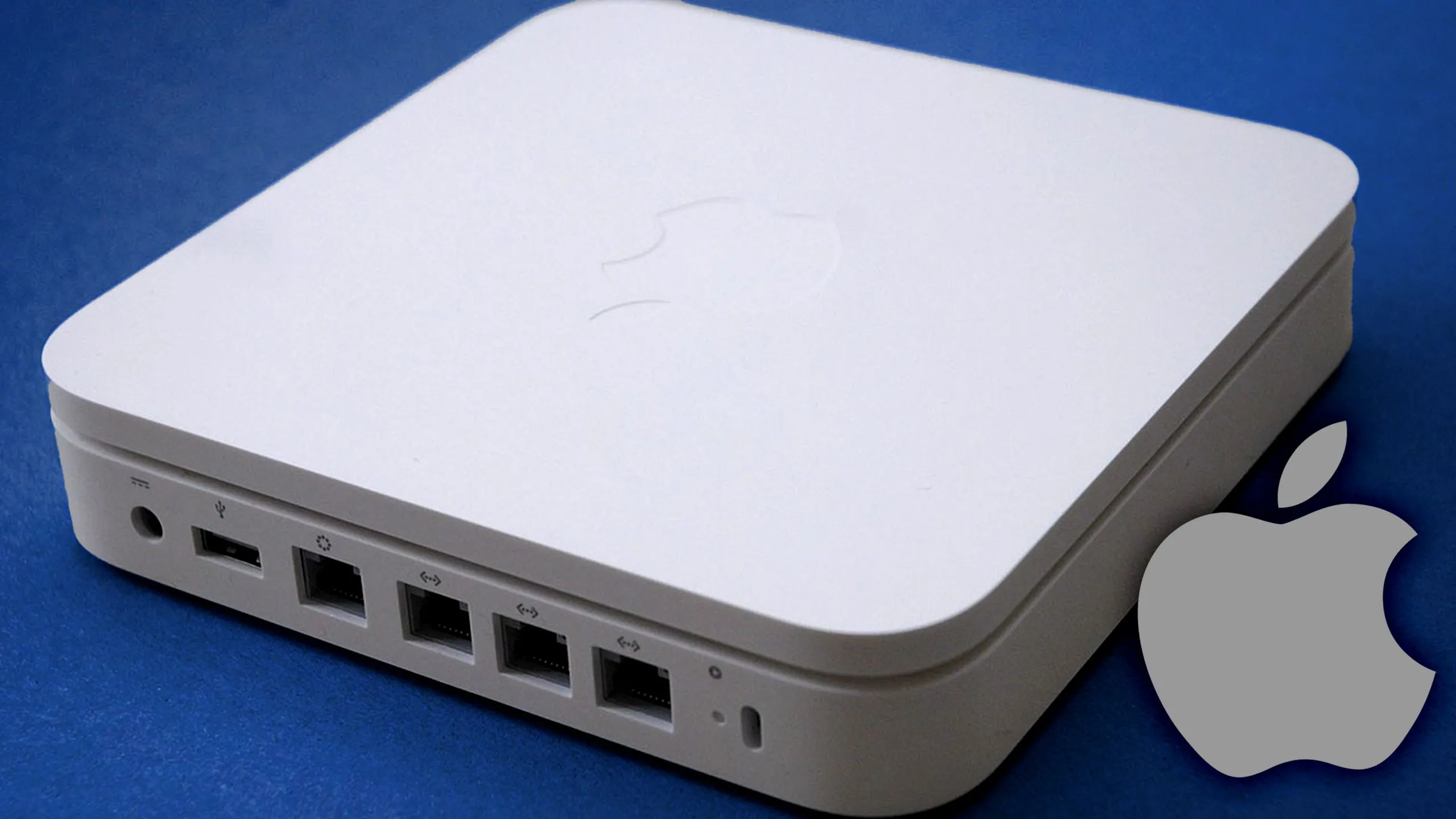 Apple AirPort Extreme trên nền xanh, biểu tượng cho router Apple và giao thức mạng
