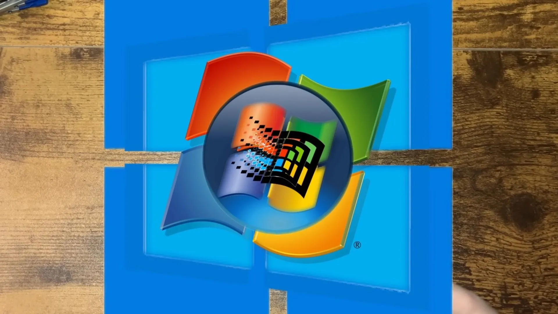 Các logo hệ điều hành Windows từ Windows 95 đến Windows 11 minh họa khái niệm chạy Windows lồng nhau qua máy ảo.