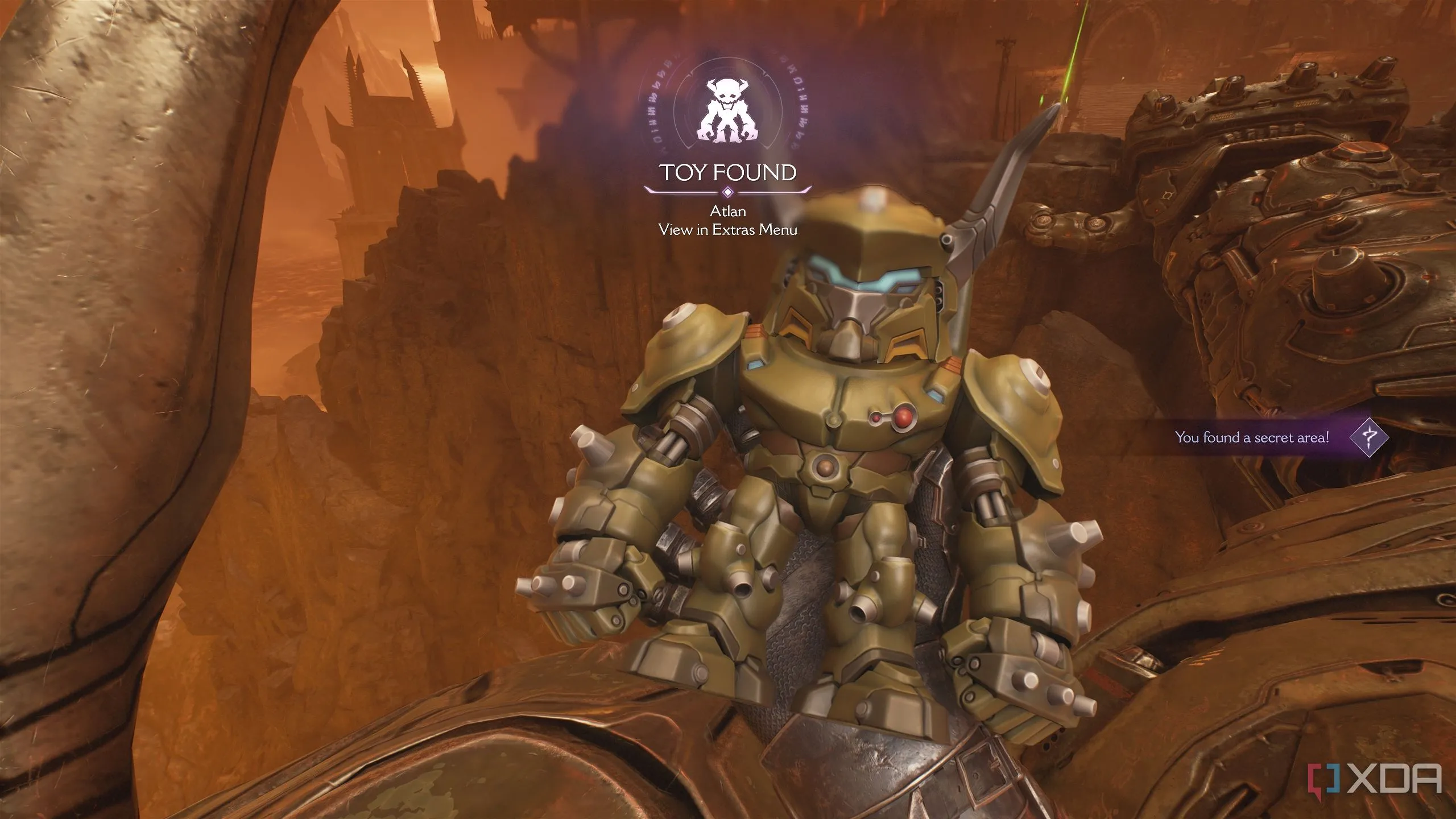 Đồ chơi sưu tầm Atlan Mech nằm trên vai của cỗ máy trong Doom The Dark Ages