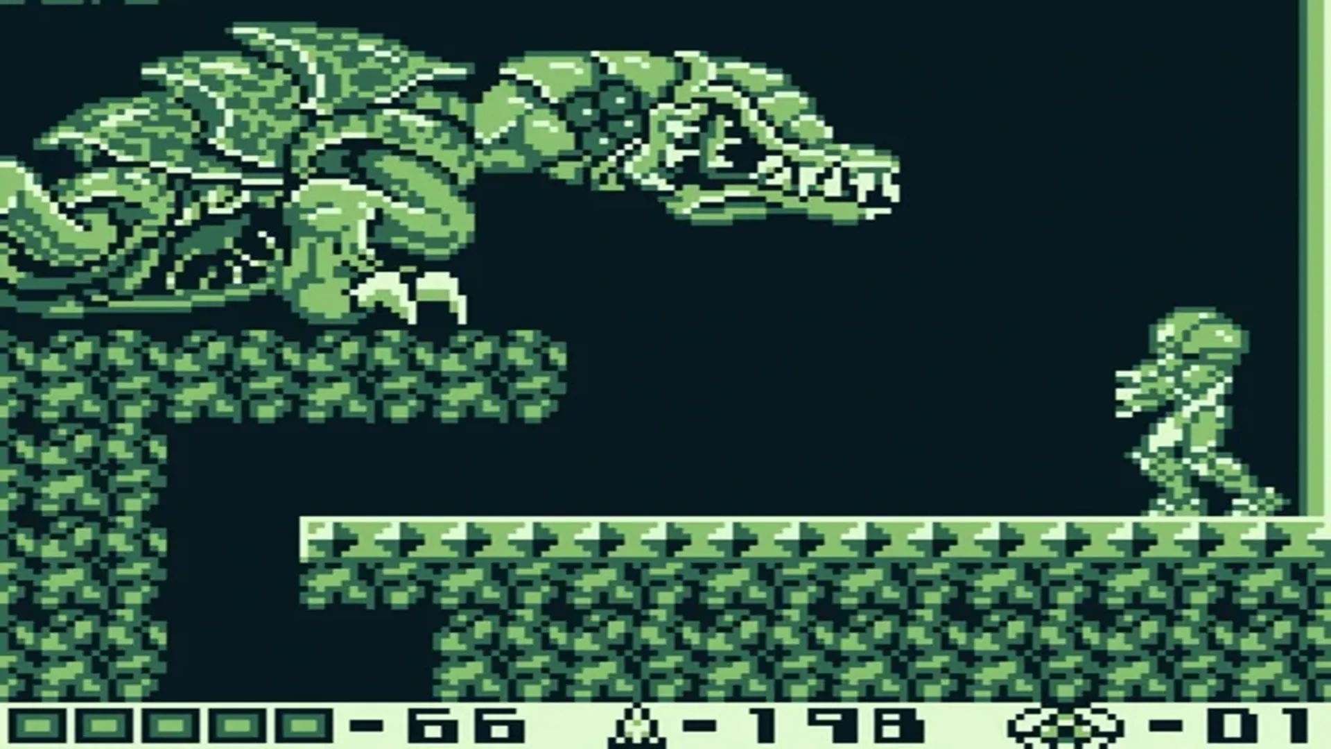 Gameplay đơn sắc của Metroid II: Return of Samus trên Game Boy, nơi Samus săn lùng Metroid trên hành tinh SR388.