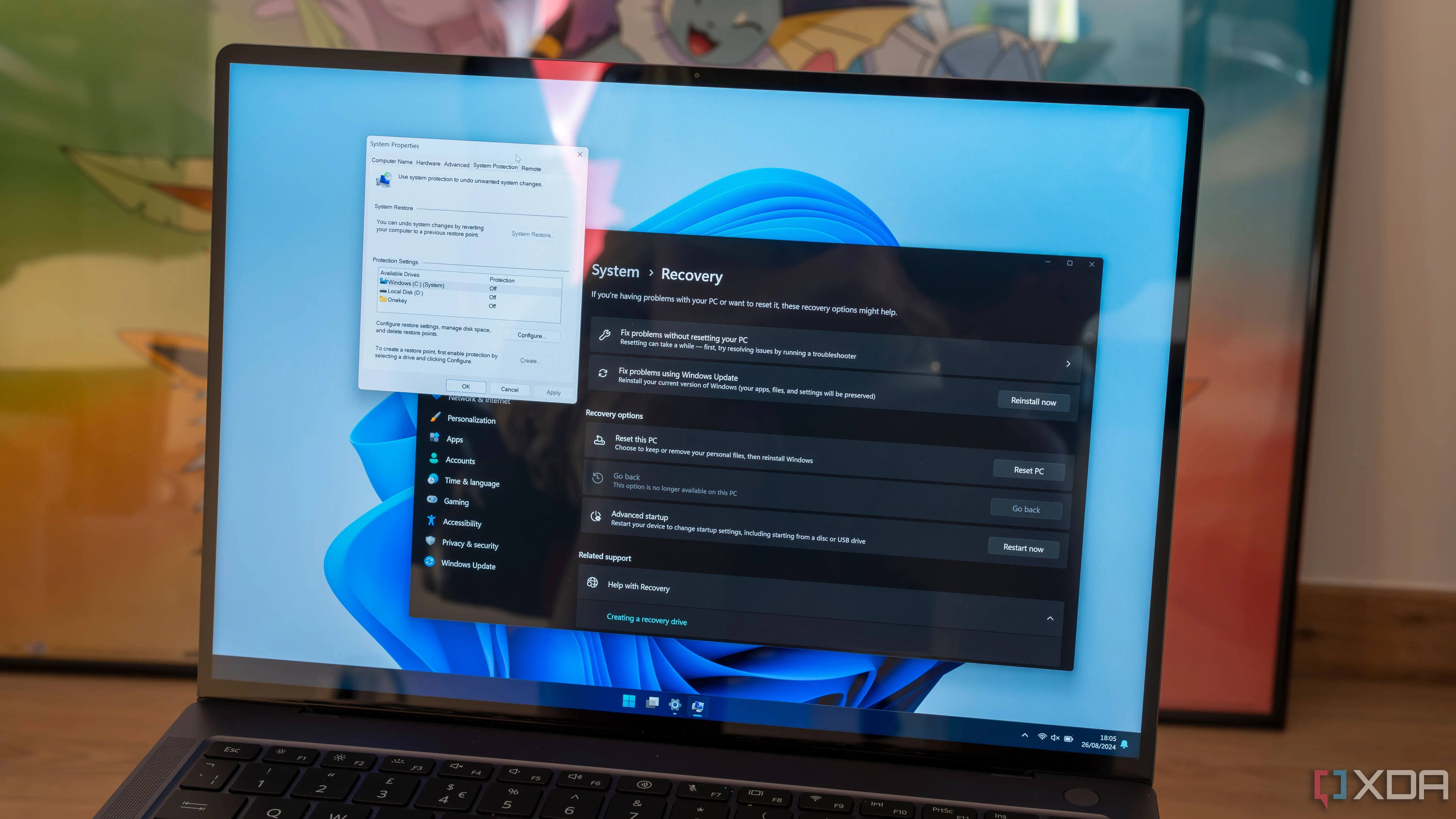 Giao diện ứng dụng Cài đặt Windows 11 và hộp thoại Control Panel hiển thị tùy chọn khôi phục