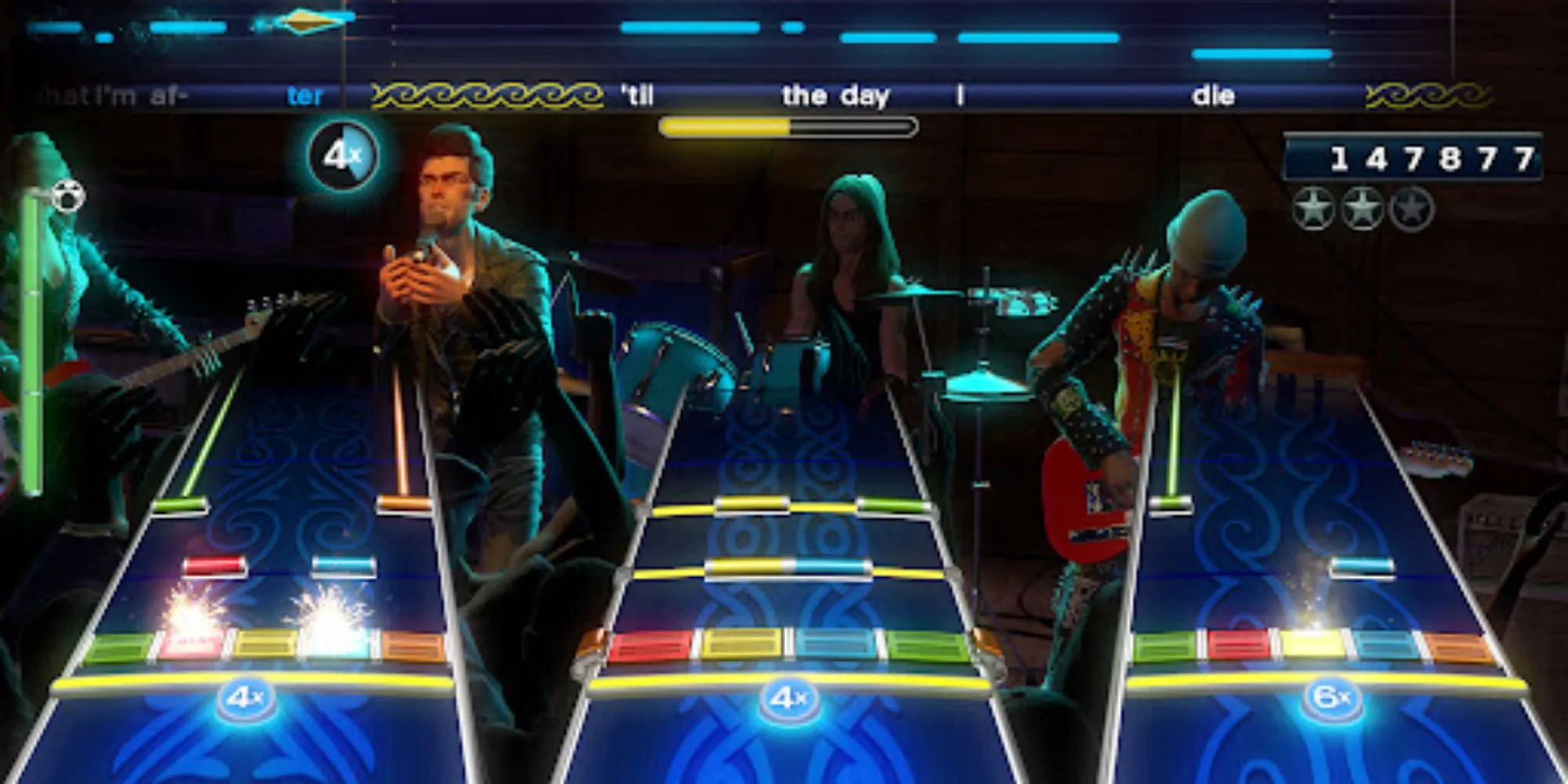 Hình ảnh nhóm nhạc đang biểu diễn trong game Rock Band 4 trên Xbox One, thể hiện trải nghiệm chơi nhạc cụ sống động