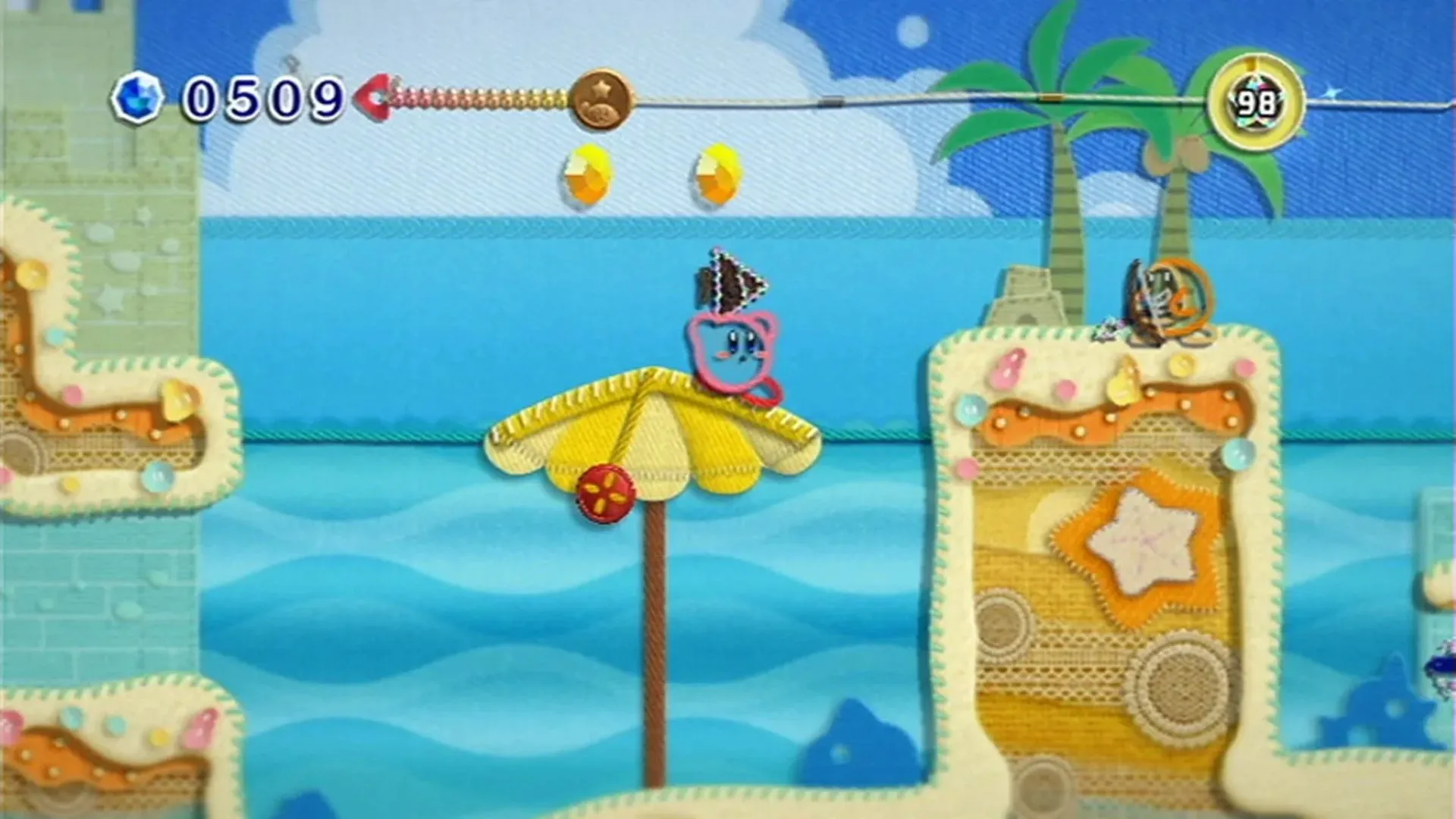 Kirby trong thế giới được dệt từ sợi len đầy màu sắc trong game Kirby's Epic Yarn trên Nintendo Wii
