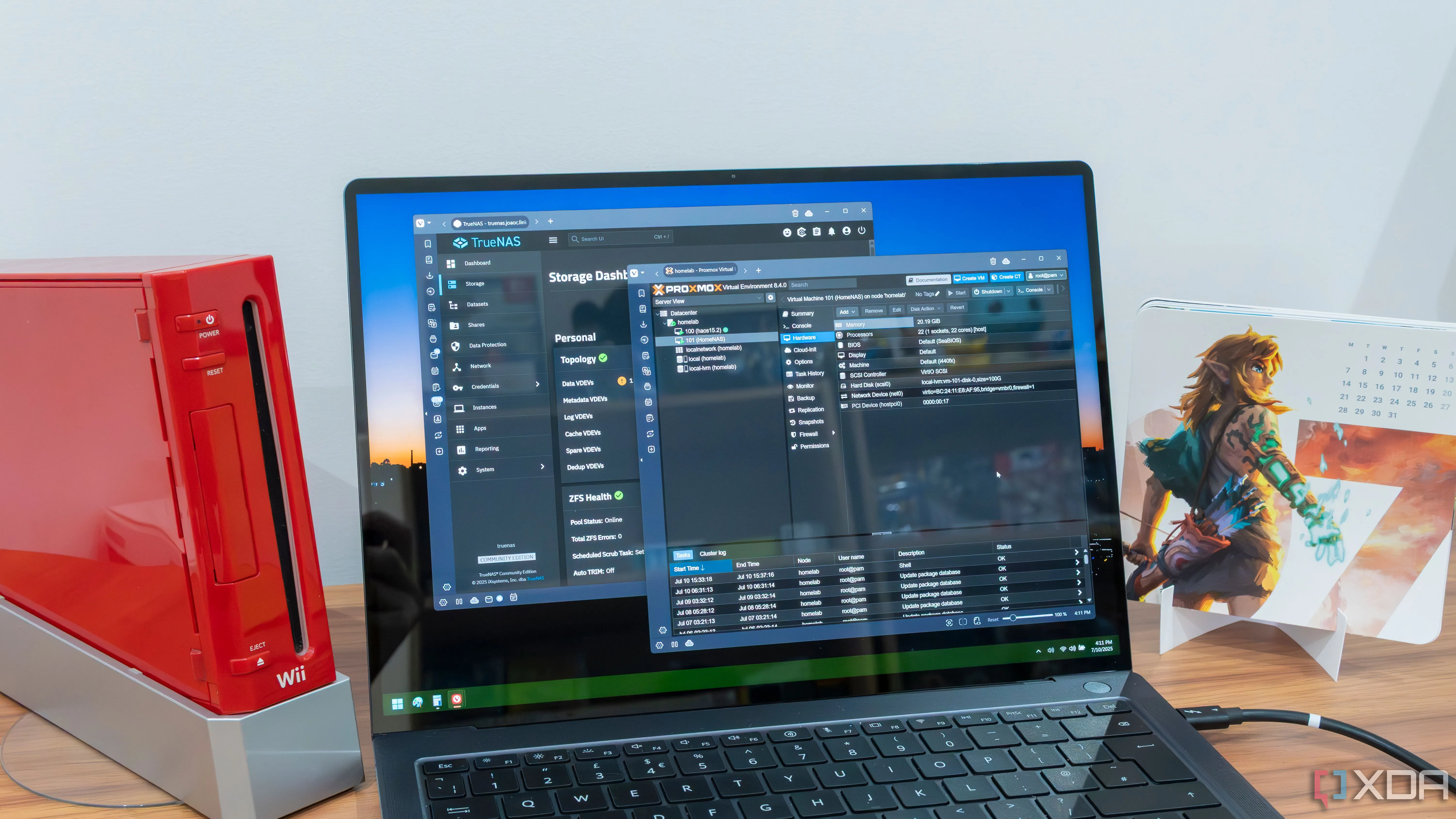 Màn hình laptop hiển thị giao diện điều khiển TrueNAS và Proxmox