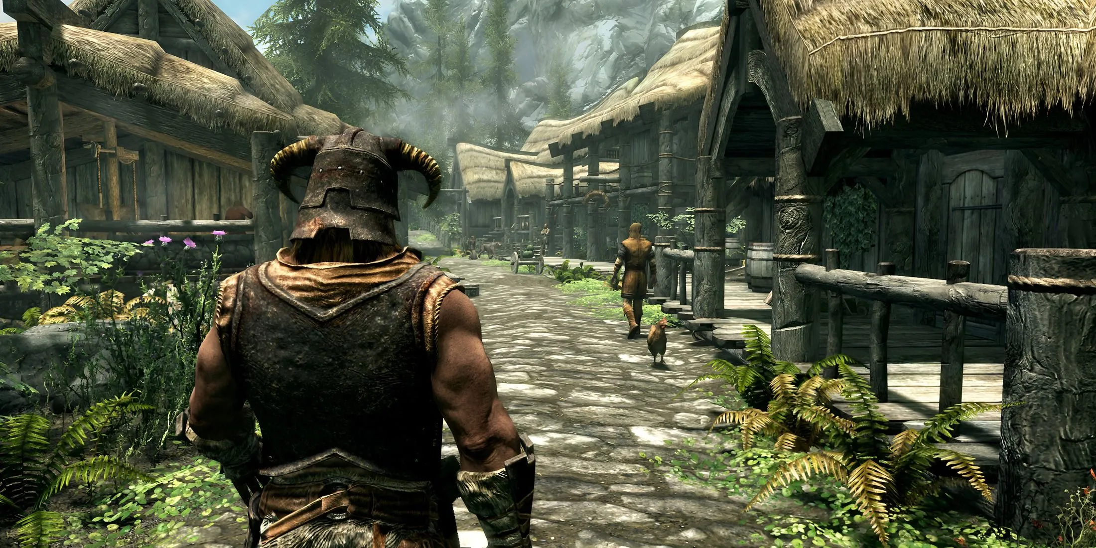 Nhân vật Dragonborn trong The Elder Scrolls V: Skyrim đi bộ qua một ngôi làng