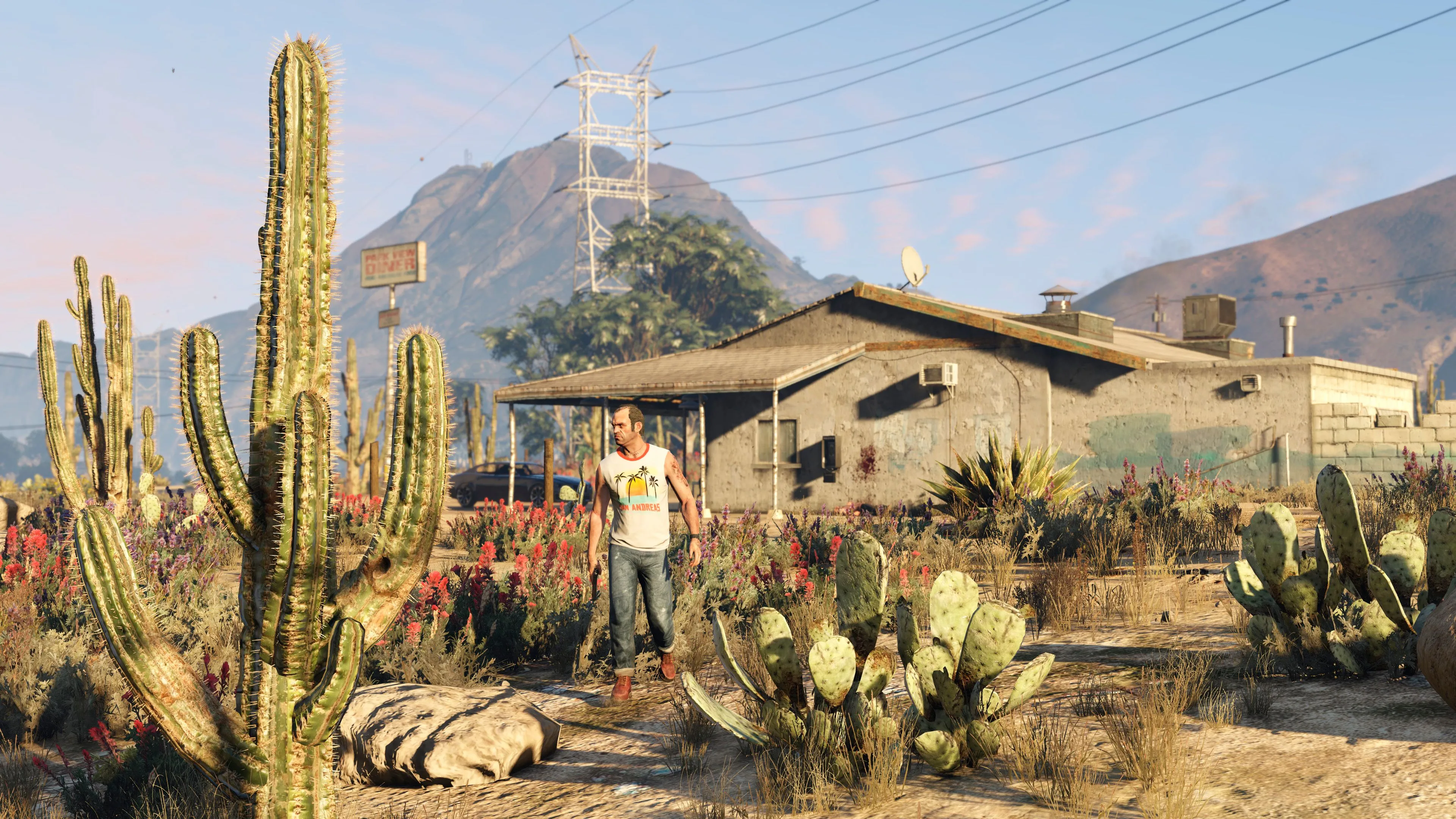 Nhân vật Trevor Philips đi bộ trước một ngôi nhà tại Blaine County, Grand Theft Auto V, biểu trưng cho sự phân bổ tài nguyên phát triển